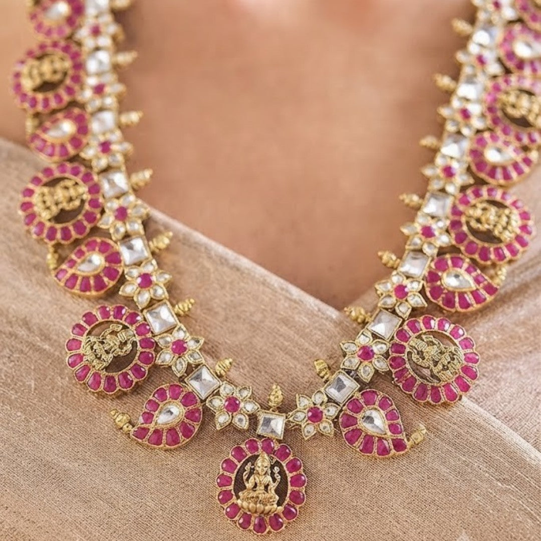 Gold-plated Kundan necklace set with pink ruby-look stones and matching statement earrings for bridal, wedding, festive, and traditional wear.