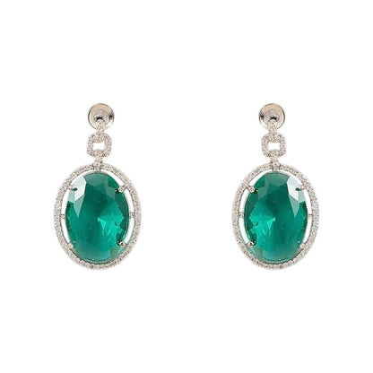 Silver plated American Diamond necklace set with emerald green oval pendant and matching drop earrings on white background