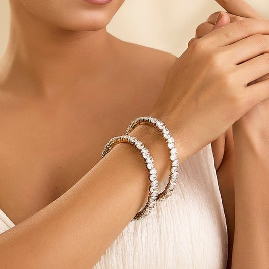 White leaf-shaped stone studded gold tone designer bangle set for women
