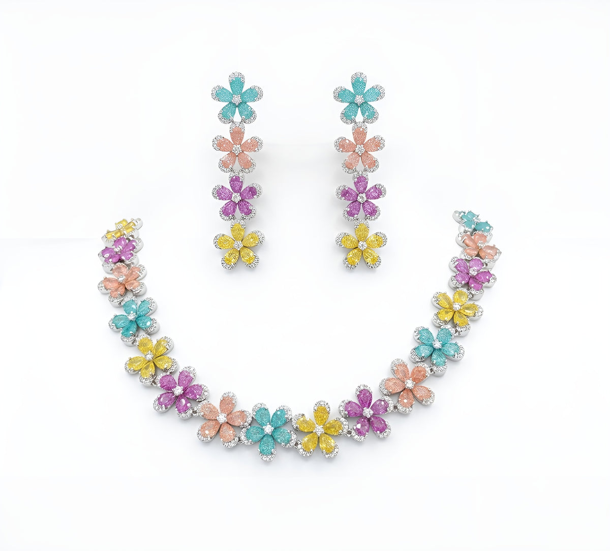 Silver plated multicolour flower American diamond necklace set with aqua, peach, pink and yellow stones and matching drop earrings on a marble slab