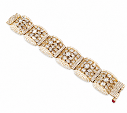 "Gold-tone bridal bracelet with pearl beading and white kundan polki crystal panels"