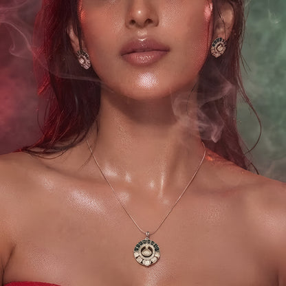 "Gold-tone kundan polki necklace and earring set with emerald-green enamel detailing and round uncut diamond-style pendant, on white background"