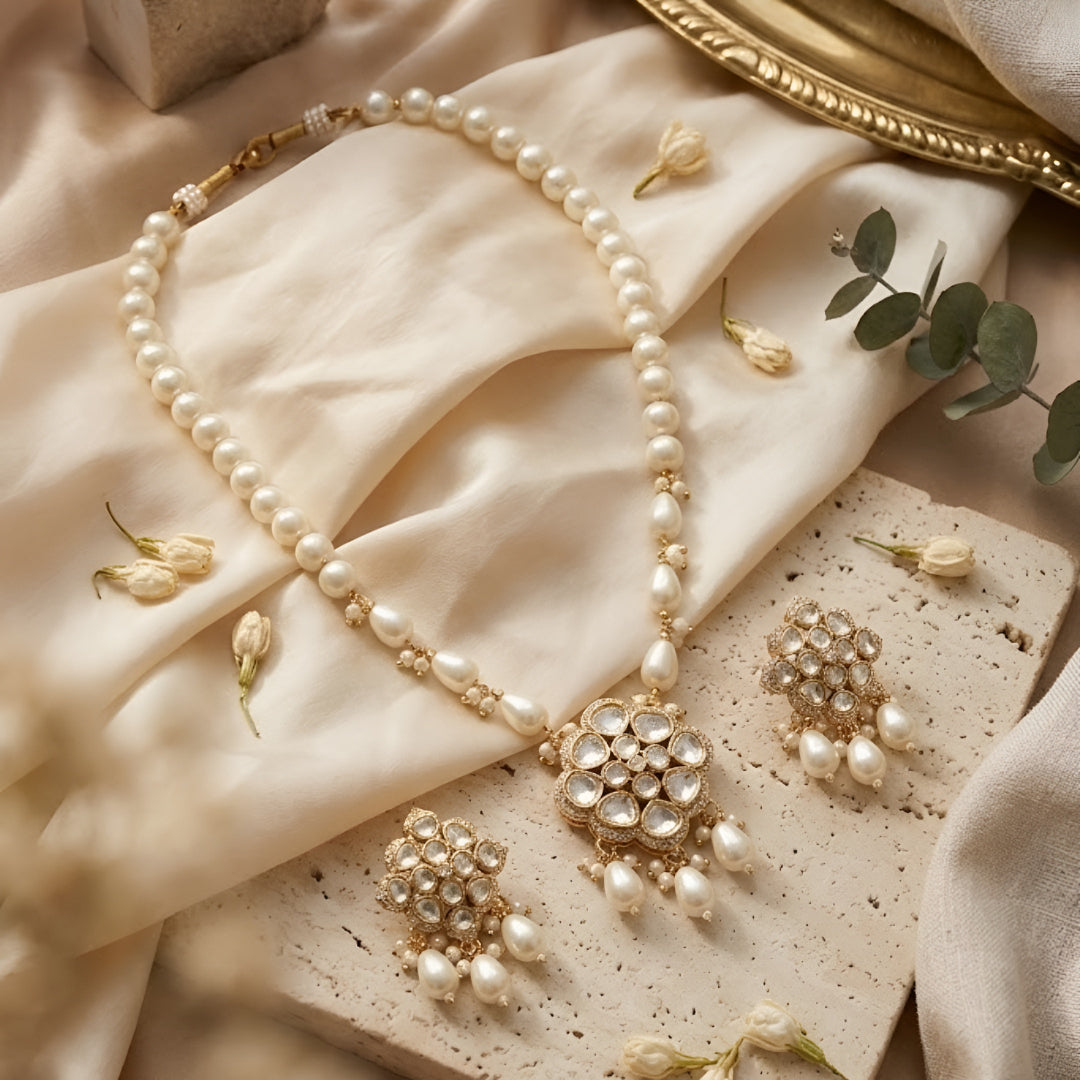Elegant pearl necklace set with Kundan-style pendant and matching pearl drop earrings


