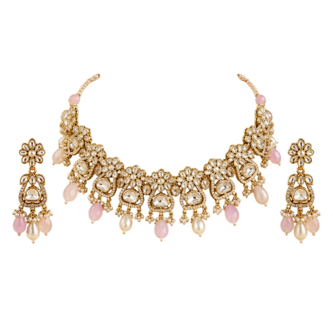 Gold-plated floral Kundan choker necklace set with pink beads, pearl drops, and matching earrings for bridal, wedding, and festive wear.