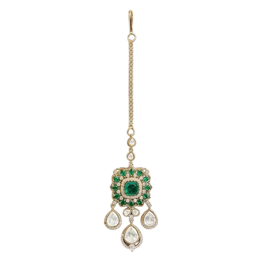Gold-plated Kundan maang tikka with emerald green stones and teardrop drops, traditional Indian bridal hair jewelry