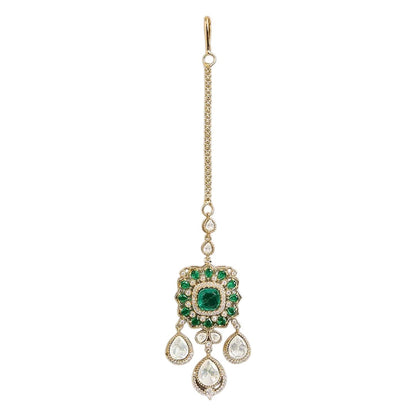 Gold-plated Kundan maang tikka with emerald green stones and teardrop drops, traditional Indian bridal hair jewelry