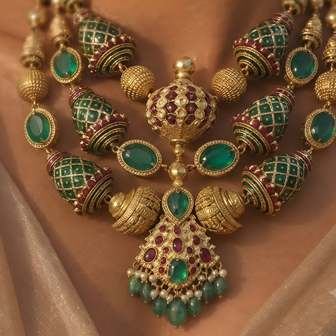 "Antique gold plated kundan polki bridal necklace set with emerald and ruby stones, peacock wing pendant design, and matching jhumka earrings"