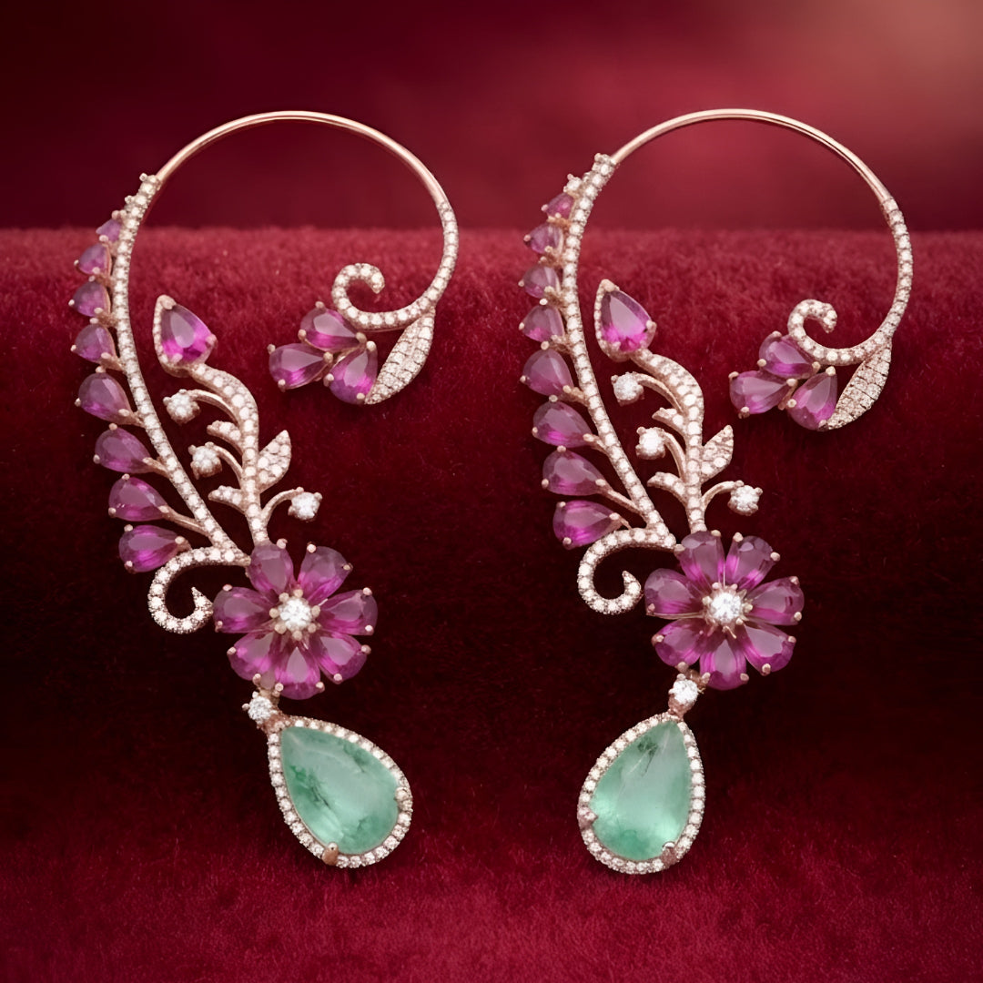 Rose gold ear cuff earrings with ruby pink pear-cut flower, pavé zircon vine design and mint green teardrop stone