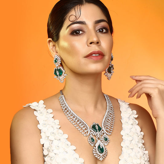 Silver plated green stone bridal necklace set with matching earrings featuring CZ diamond detailing and elegant pendant design