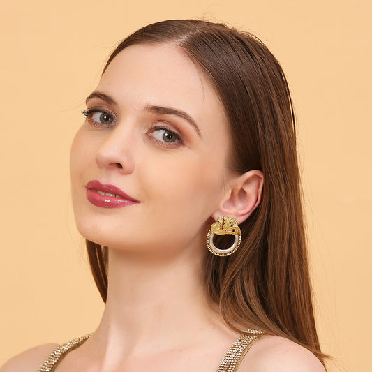 Dual tone gold and silver floral hoop earrings with intricate traditional design on neutral background