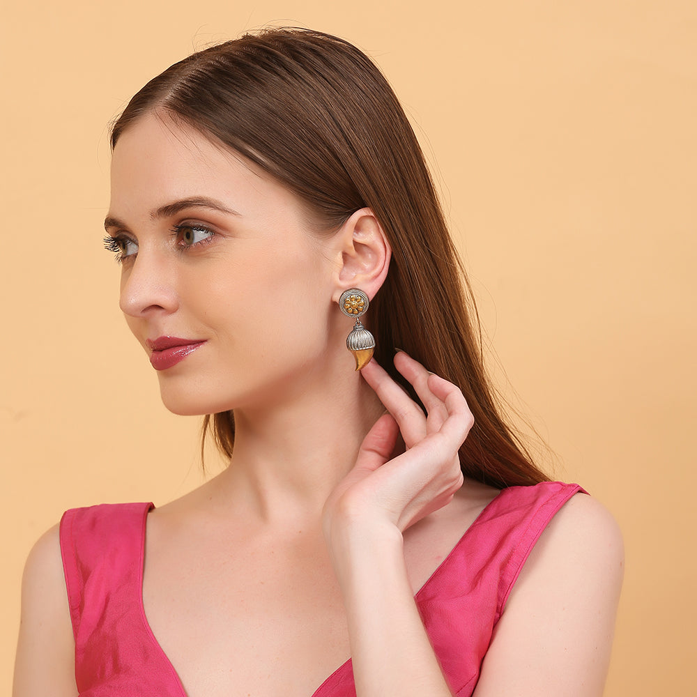 Dual tone antique finish floral jhumka earrings with gold flower stud and textured drop design