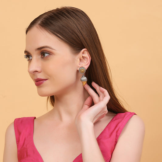 Dual tone antique finish floral jhumka earrings with gold flower stud and textured drop design