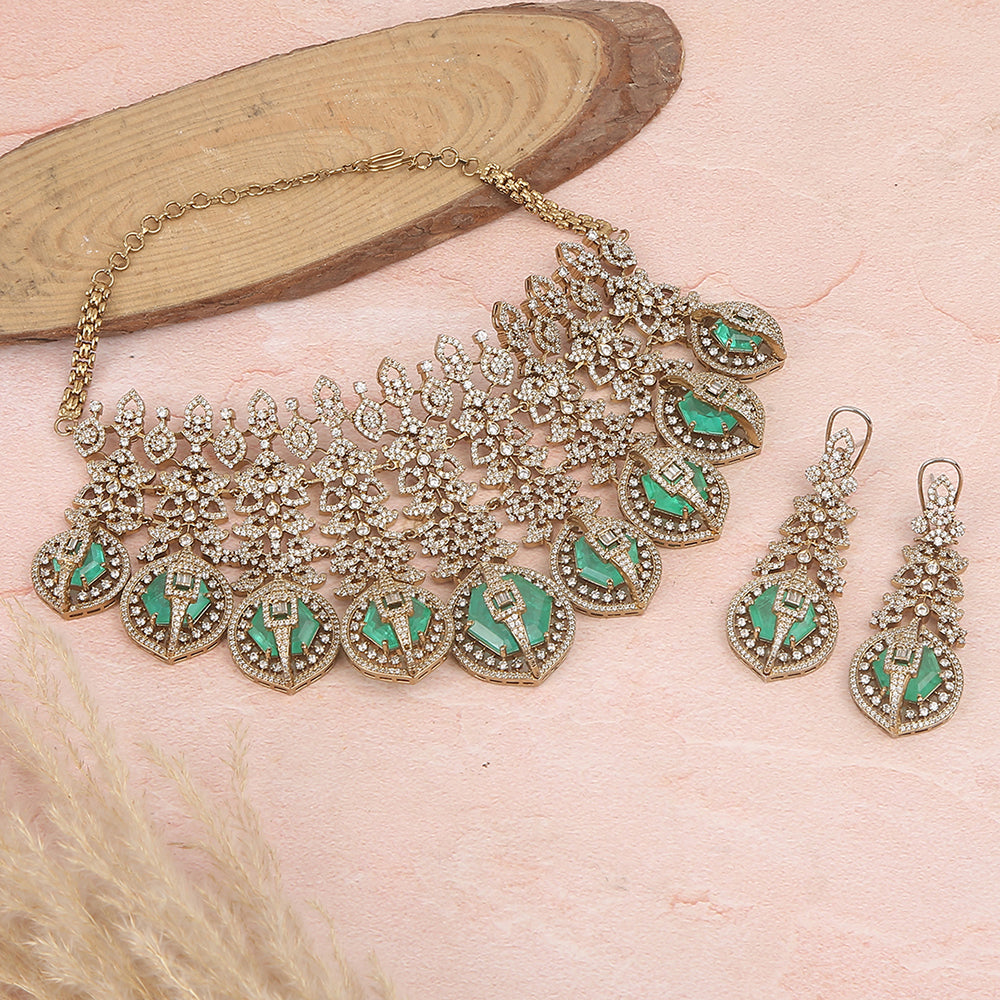 Gold plated choker necklace set with green stones and matching long earrings for bridal and party wear