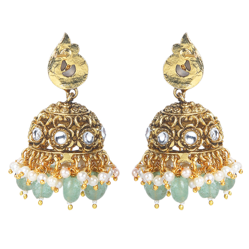 Gold plated temple Lakshmi bridal necklace set with pink green stones and jhumka earrings with pearl and bead drops on white background