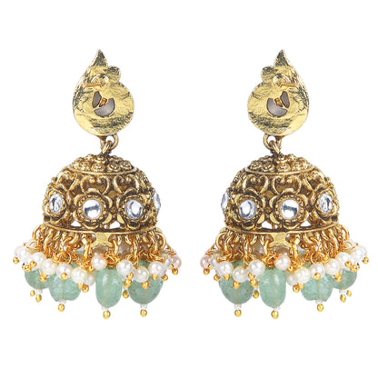 Gold plated temple Lakshmi bridal necklace set with pink green stones and jhumka earrings with pearl and bead drops on white background