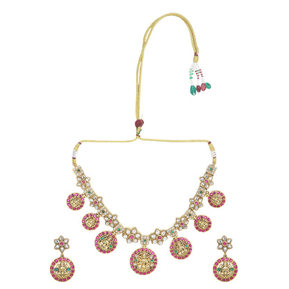 Gold plated Lakshmi coin necklace set with pink stones and matching earrings on white background