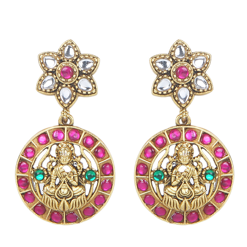 Gold plated Lakshmi coin necklace set with pink stones and matching earrings on white background