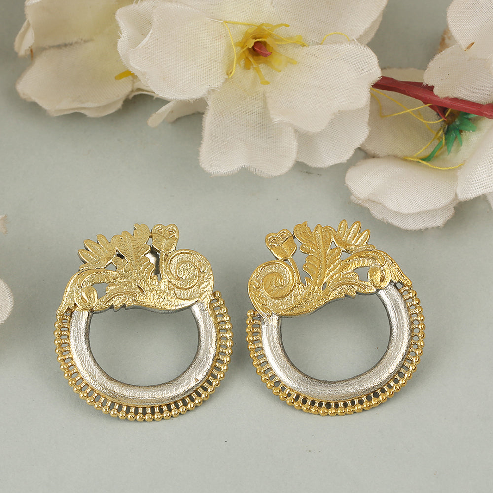Dual tone gold and silver floral hoop earrings with intricate traditional design on neutral background