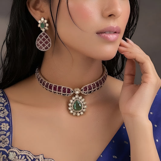 "Antique gold rigid choker necklace with ruby pavé lattice design and emerald pear pendant, matching earrings"