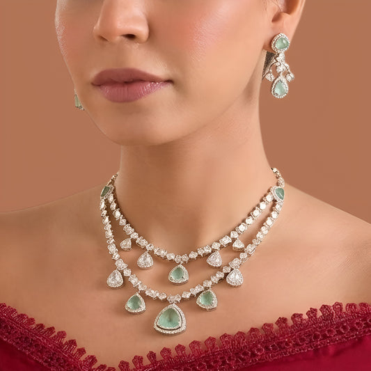 Gold finish two-layer American diamond necklace set with mint green triangular stones, polki-style clear drops and matching chandelier earrings – Auraa Trends