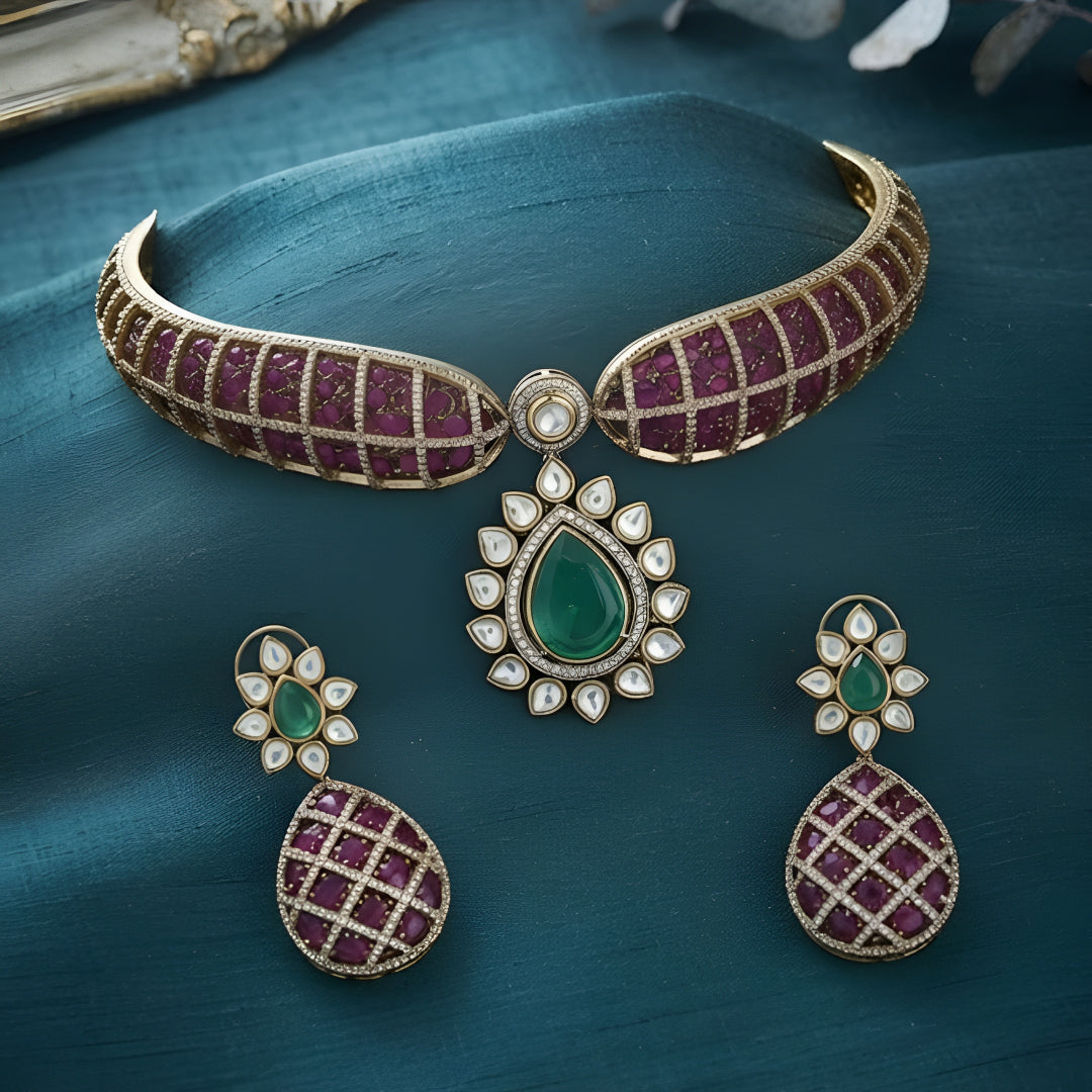 "Antique gold rigid choker necklace with ruby pavé lattice design and emerald pear pendant, matching earrings"