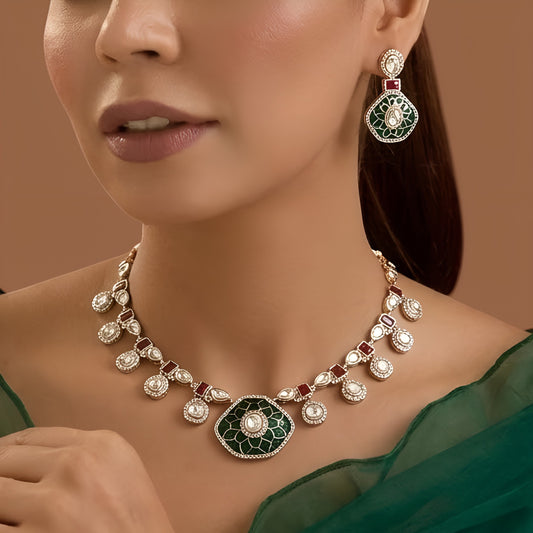 Gold finish kundan choker necklace set with green enamel lotus medallion, ruby red stones, polki-style drops and matching drop earrings – Auraa Trends