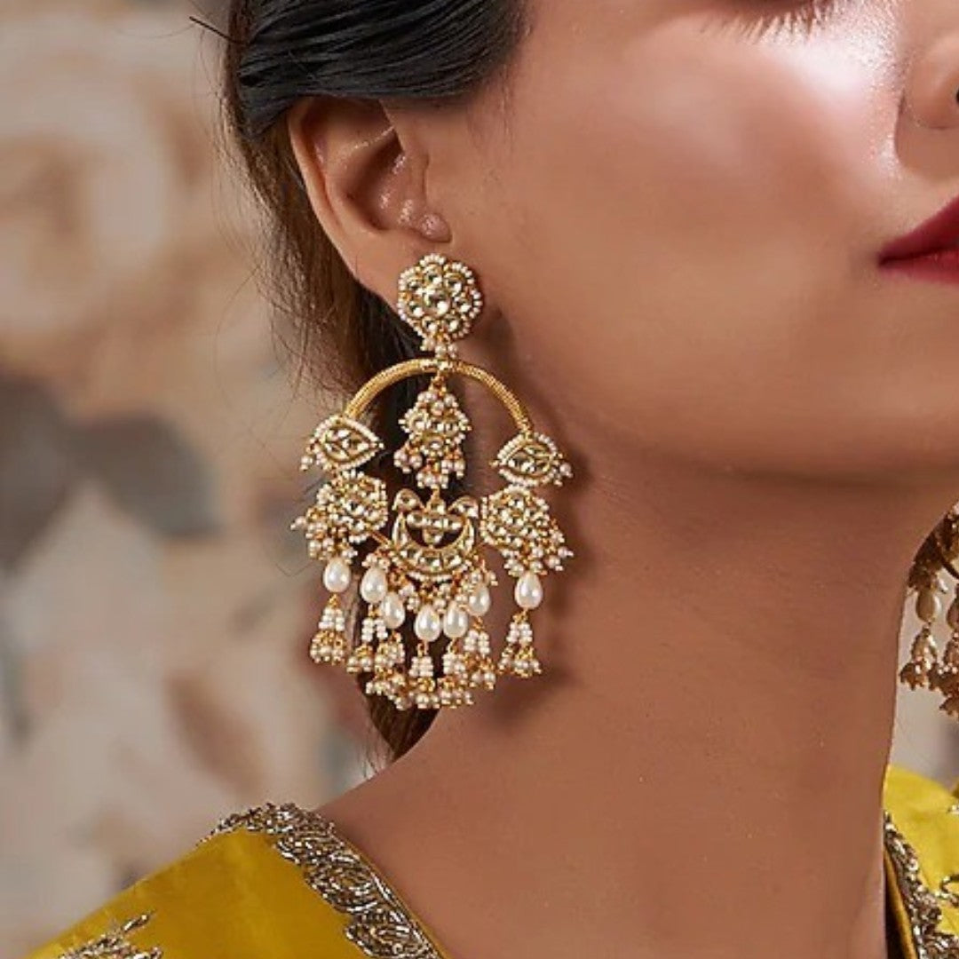 Gold kundan chandbali earrings with pearl beadwork and jhumka-style drops