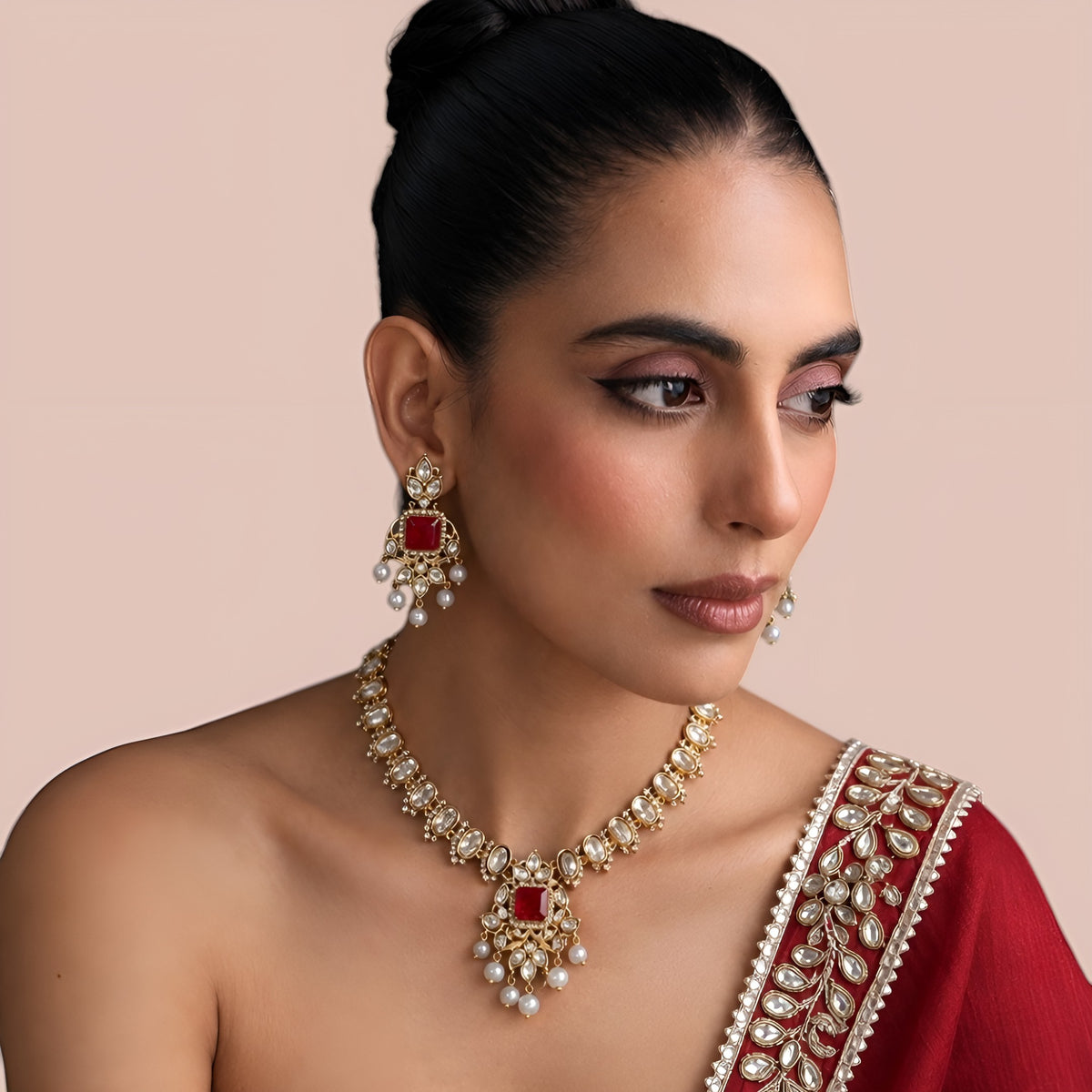 Gold finish kundan polki necklace set with ruby red square stone pendant and pearl drops