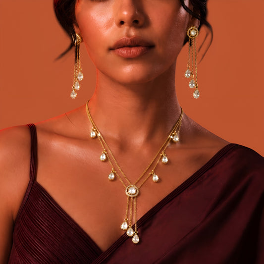 Gold plated double-chain necklace set with pear-shaped zircon drops and matching tassel earrings