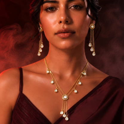Gold plated double-chain necklace set with pear-shaped zircon drops and matching tassel earrings