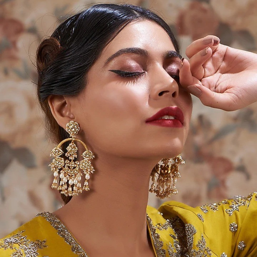 Gold kundan chandbali earrings with pearl beadwork and jhumka-style drops