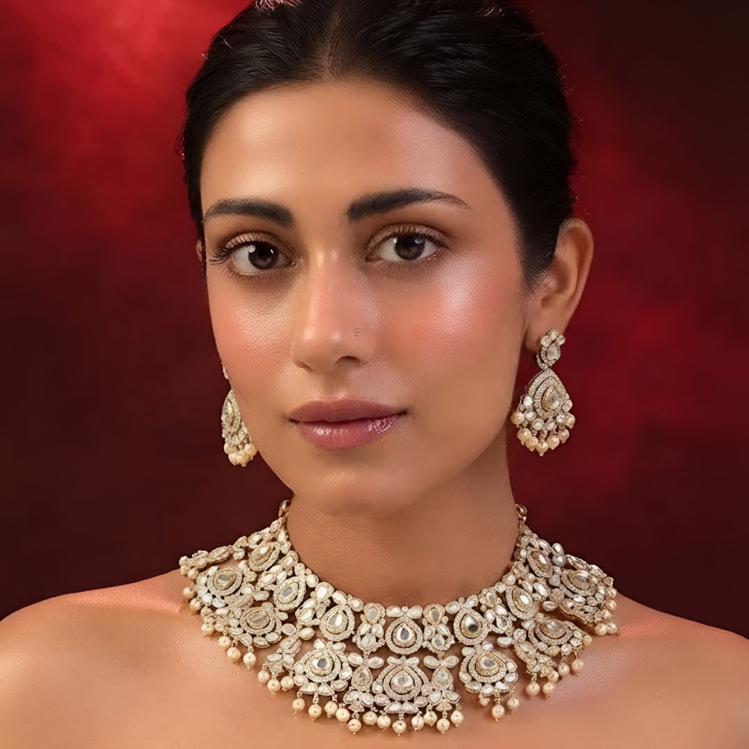 White Kundan necklace set with gold-tone detailing pearl drops and matching earrings
