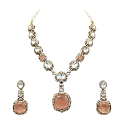 Antique gold Victorian kundan necklace with a large square peach-pink pendant and matching drop earring on a grey display bust
