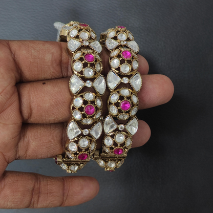 Gold-plated Kundan bangles with pink stone and white crystal detailing for women