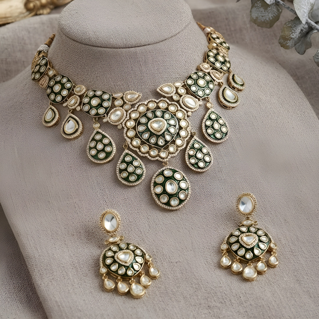 "Antique gold Kundan choker necklace with green meenakari enamel and polki stone medallions, matching disc drop earrings"