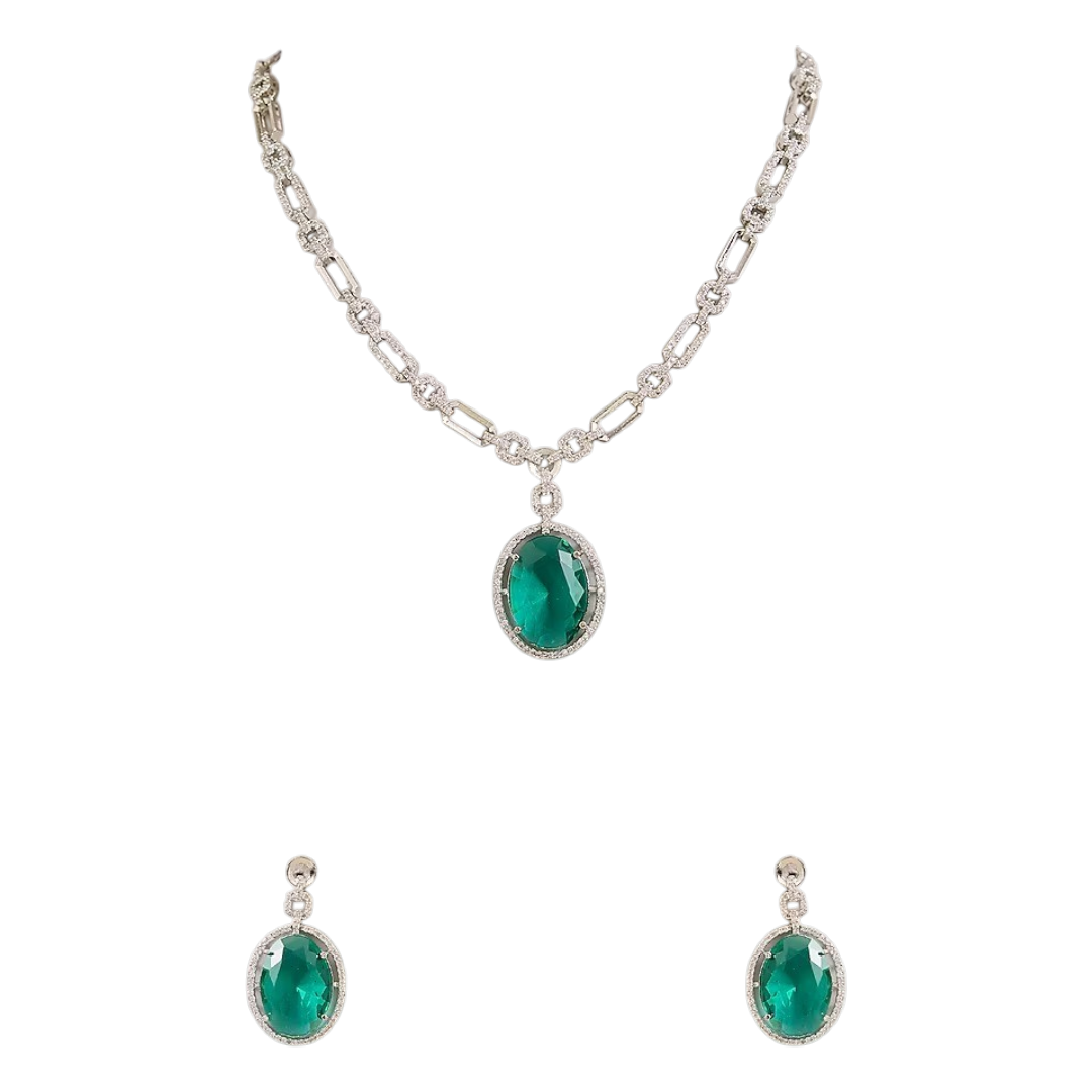 Silver plated American Diamond necklace set with emerald green oval pendant and matching drop earrings on white background