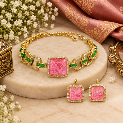 Gold plated choker necklace set with large square pink stone, green baguette stone links and matching pink stud earrings
