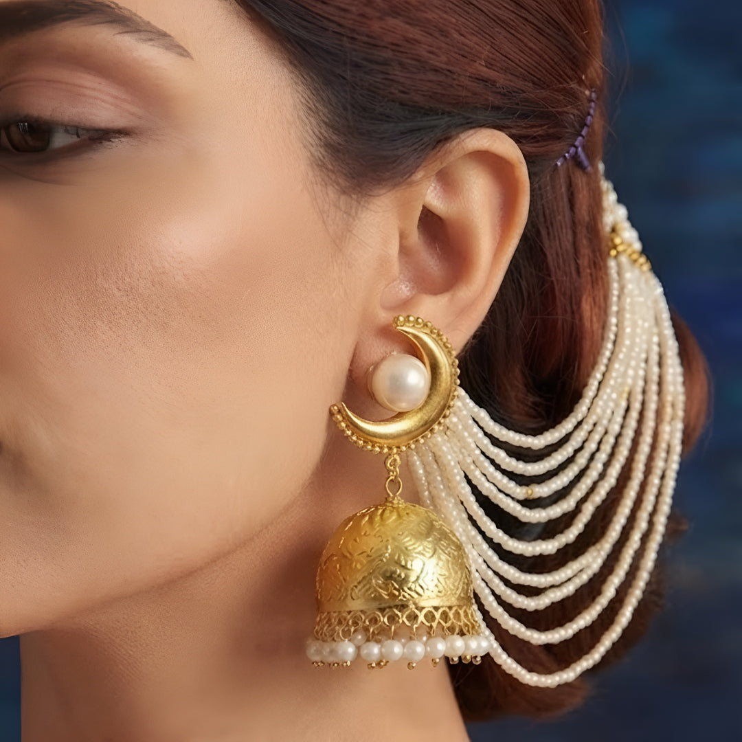 Gold-plated long pearl chain jhumka earrings for women with cascading pearl strands and statement ethnic design.
