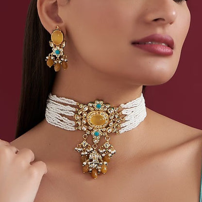 Multi-strand white beaded kundan choker necklace with yellow stone centrepiece and yellow bead drops, shown with matching earrings