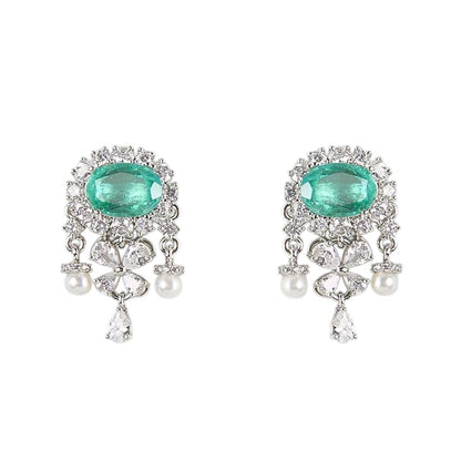 "Silver rhodium-plated drop earrings with oval emerald stone, diamond halo, clover-shaped white stones and pearl bead accents"