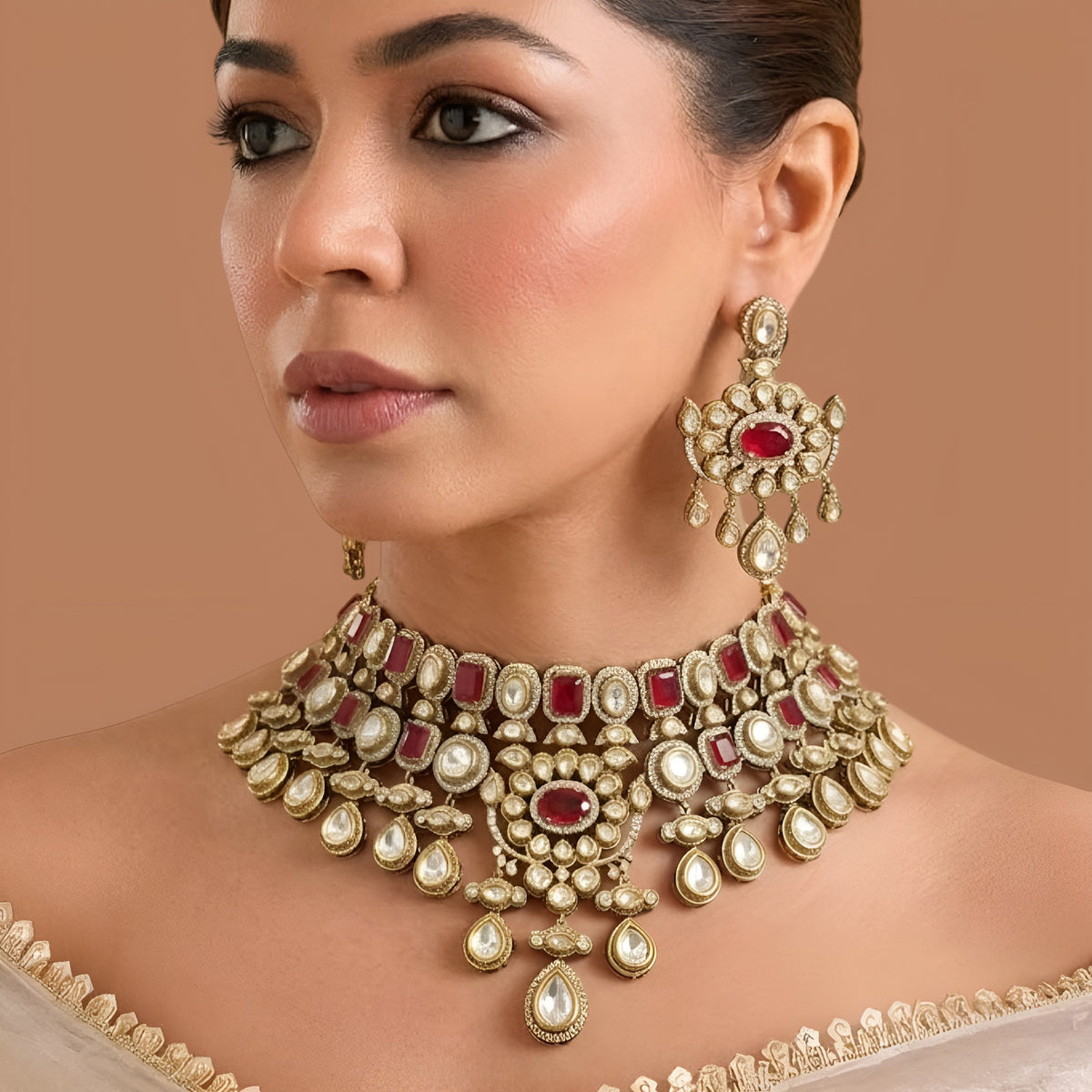 Antique gold ruby red Victorian bridal choker necklace set with kundan-style stones, ruby oval centre medallion, pear drops and matching chandelier earrings