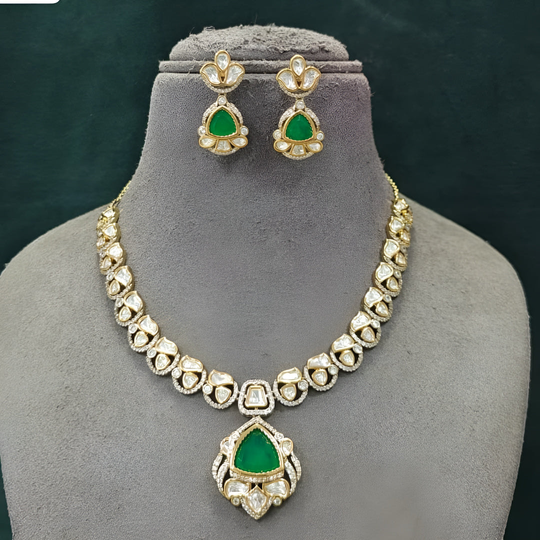 Green kundan pendant necklace set with emerald triangular stone, kundan petals and matching drop earrings