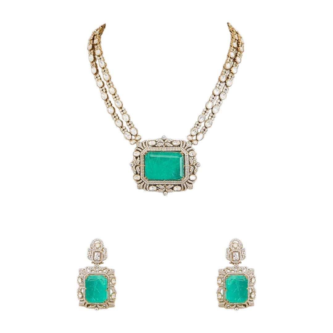 "Antique gold double-strand necklace with large emerald-cut pendant and polki stone detailing, matching drop earrings"