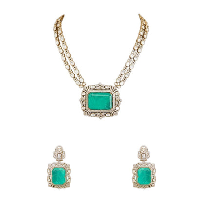 "Antique gold double-strand necklace with large emerald-cut pendant and polki stone detailing, matching drop earrings"