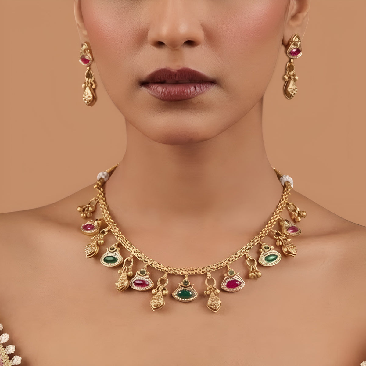 Antique gold finish necklace set with ruby pink and green marquise stone charms and gold bead drops