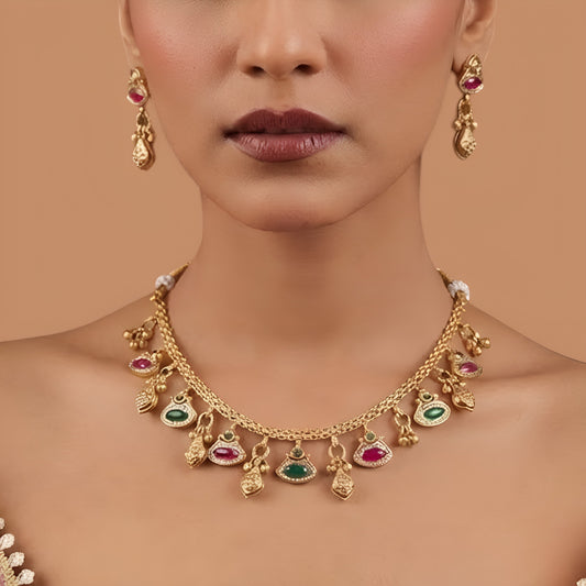 Antique gold finish necklace set with ruby pink and green marquise stone charms and gold bead drops