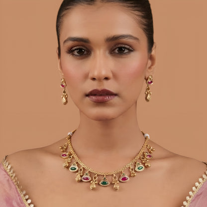 Antique gold finish necklace set with ruby pink and green marquise stone charms and gold bead drops