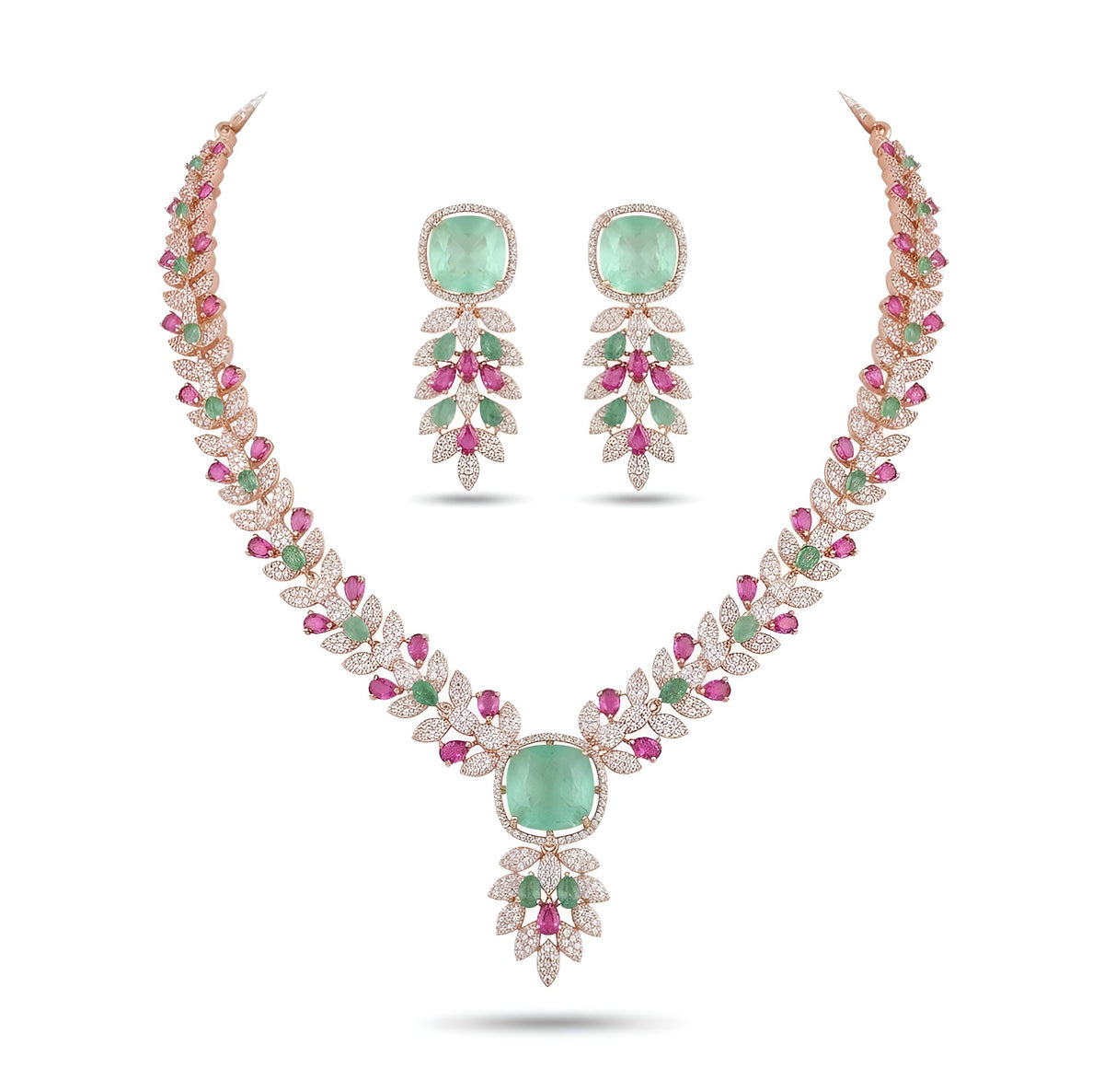 Rose gold American diamond leaf-vine necklace set with a mint-green square centre stone, ruby-pink accents and matching leaf-drop earrings on a grey display bust