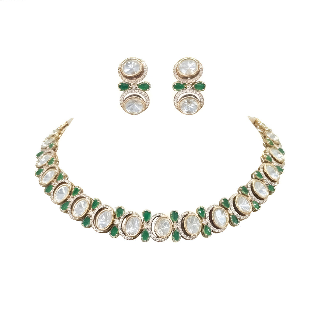 Gold-tone green kundan choker necklace set with oval kundan stones, green pear-shaped accents and matching stud drop earrings on a grey display bust