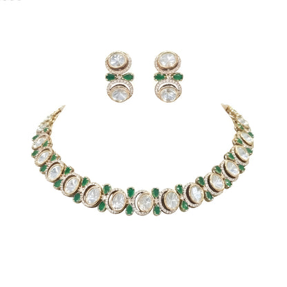 Gold-tone green kundan choker necklace set with oval kundan stones, green pear-shaped accents and matching stud drop earrings on a grey display bust